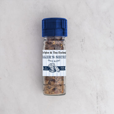 Baker's Secret spice blend container on a light gray background
