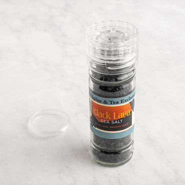 Grinder bottle of Black Lava sea salt on a white background
