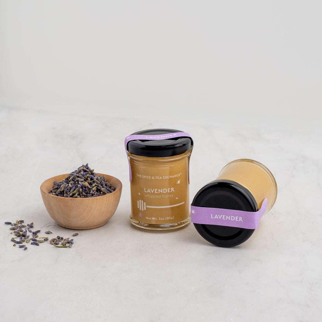 Lavender Whipped Honey Jars next to a bowl of lavender