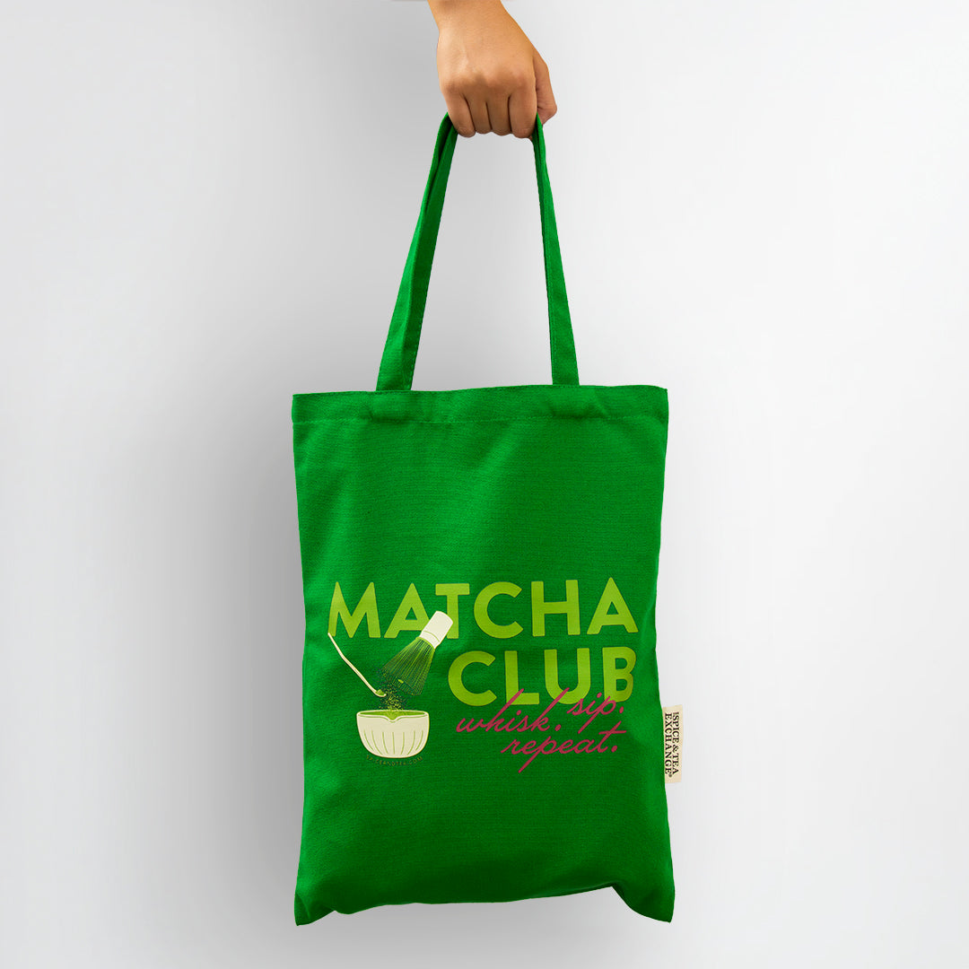 Green tote bag with 'Matcha Club' text and design on a white background