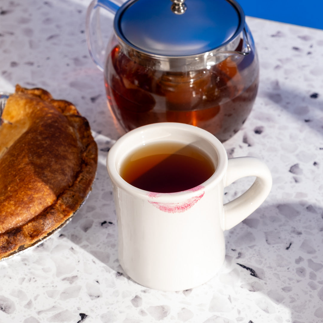 Old Fashioned Oolong Tea in mug next to pie
