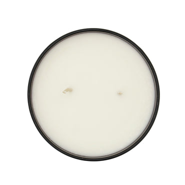 Round candle with a black lid on a white background