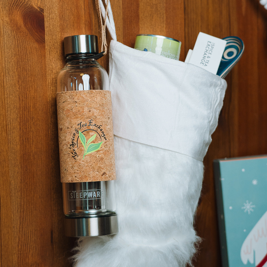 TSTE Urban Tea Tumbler attached to a wooden surface next to stocking