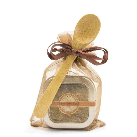 The Tuscany Spice Blend - Spice Tin with Spoon is wrapped in sheer brown organza and tied with a ribbon, featuring an attached wooden spoon—ideal for bread dipping.