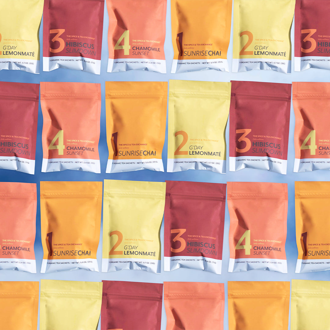 A grid of vibrant 7 Day Organic Tea Cleanse packages with names like Chamomile Slimdown, Sunrise Chai, Hibiscus Slimdown, and Lemonmate on a light blue background—ideal for your next tea cleanse.