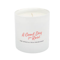 White candle with 'A Good Day for Rosé' text on a white background