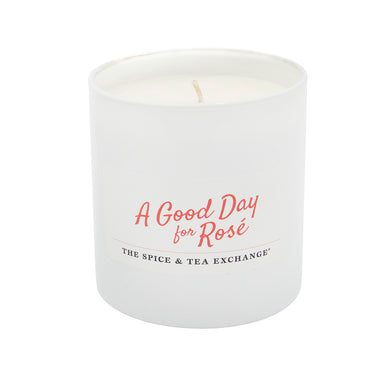 White candle with 'A Good Day for Rosé' text on a white background