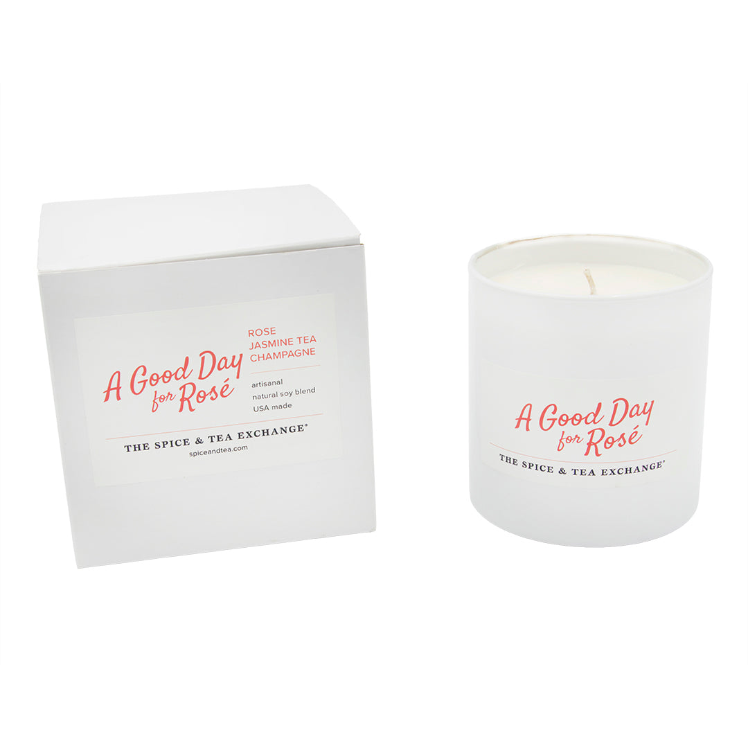 Candle and packaging labeled 'A Good Day for Rosé' by The Spice & Tea Exchange on a white background