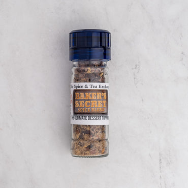 Baker's Secret spice blend container on a light gray background