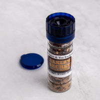 Spice grinder with 'Baker's Secret' label on a white background
