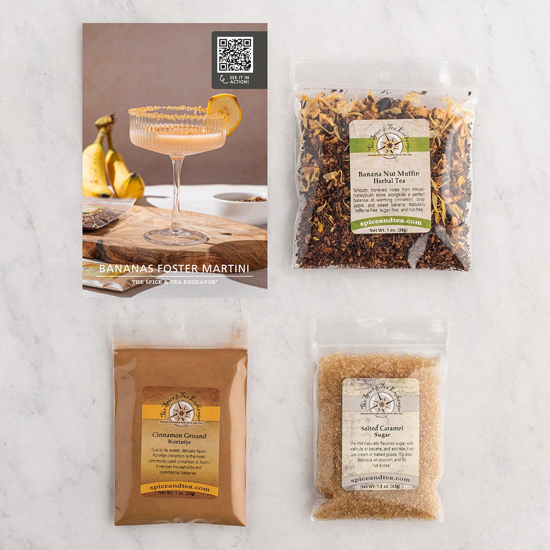 Three packaged ingredients and a recipe card arranged on a light marble surface.