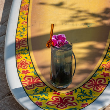 Blue Hawaiian Green Tea brewed with tropical flower garnish