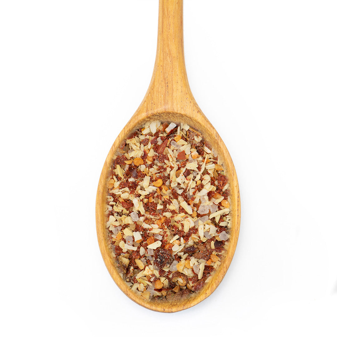 Chili Onion Fix Spice Blend in wooden spoon