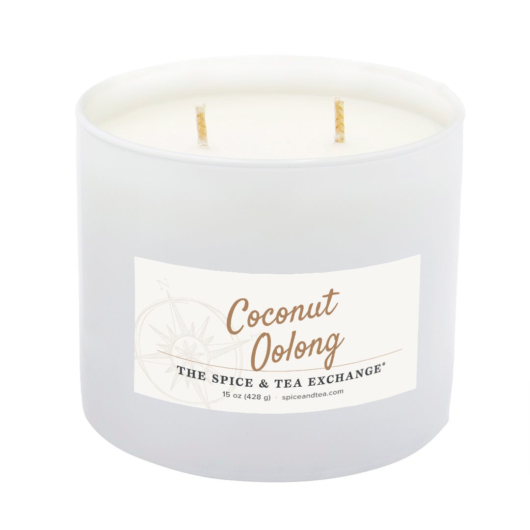 A white two-wick candle in a frosted glass jar with a white label reading 'Coconut Oolong' and 'The Spice & Tea Exchange' on a plain white background.