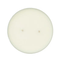 Top-down view of a round, single-wick candle with creamy off-white wax on a solid white background.