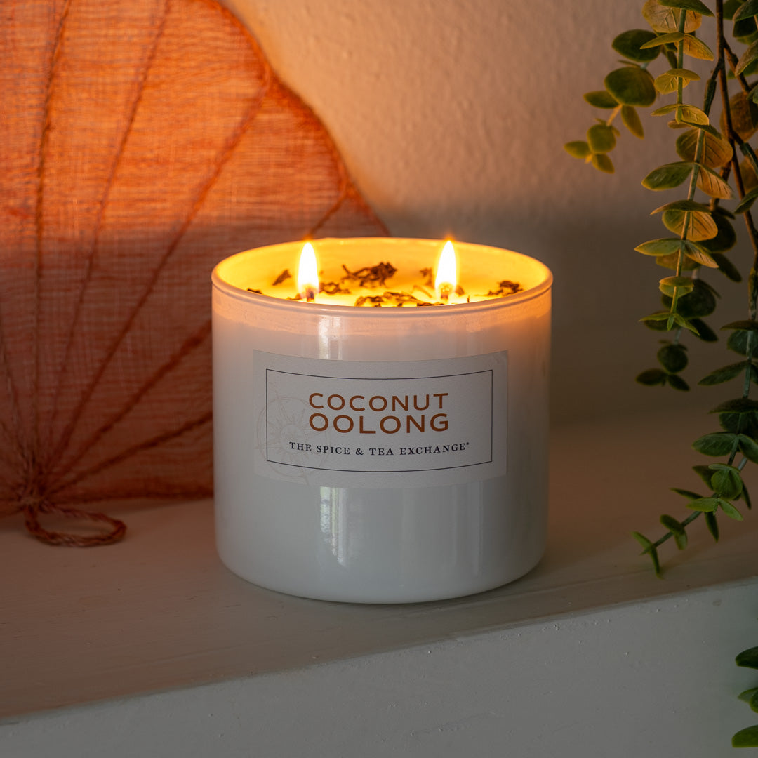 Coconut Oolong Candle lit on shell background