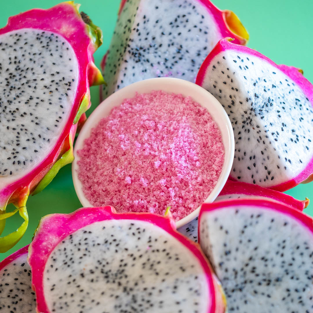Dragon Fruit Sugar in bowl surrounded by dragon fruit slices