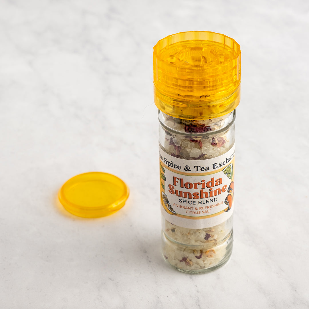 Florida Sunshine Salt Spice Blend in grinder next to lid