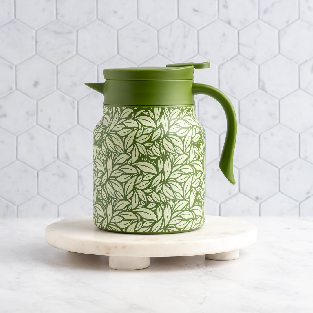 Green Hot Tea Steeper in front of tile background