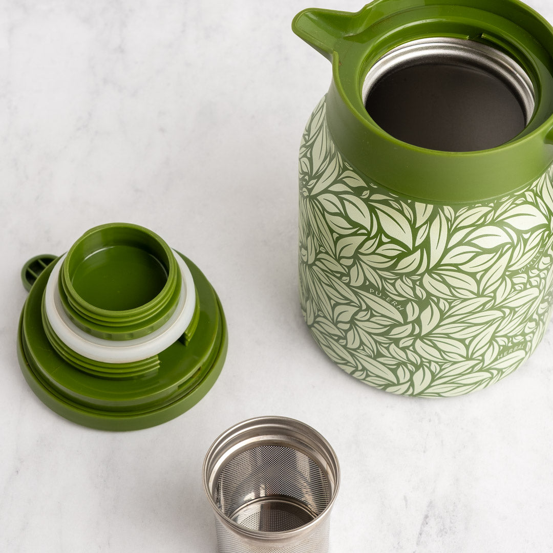 Green Hot Tea Steeper next to tea infuser