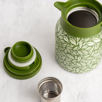 Green Hot Tea Steeper next to tea infuser