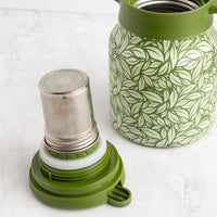 Green Hot Tea Steeper next to upside down tea infuser