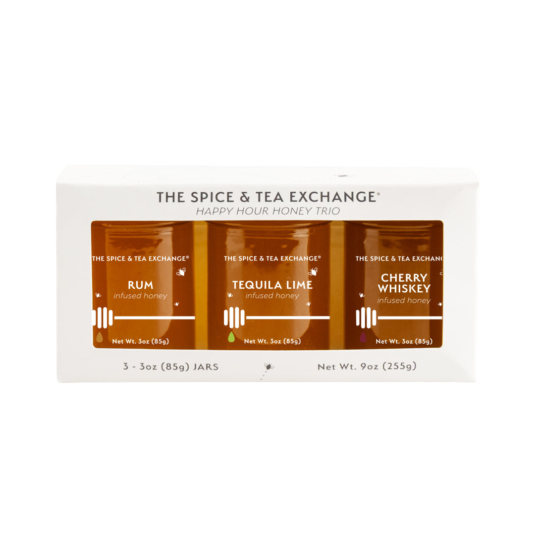 Packaging of The Spice & Tea Exchange Happy Hour honey trio with three jars on a white background.