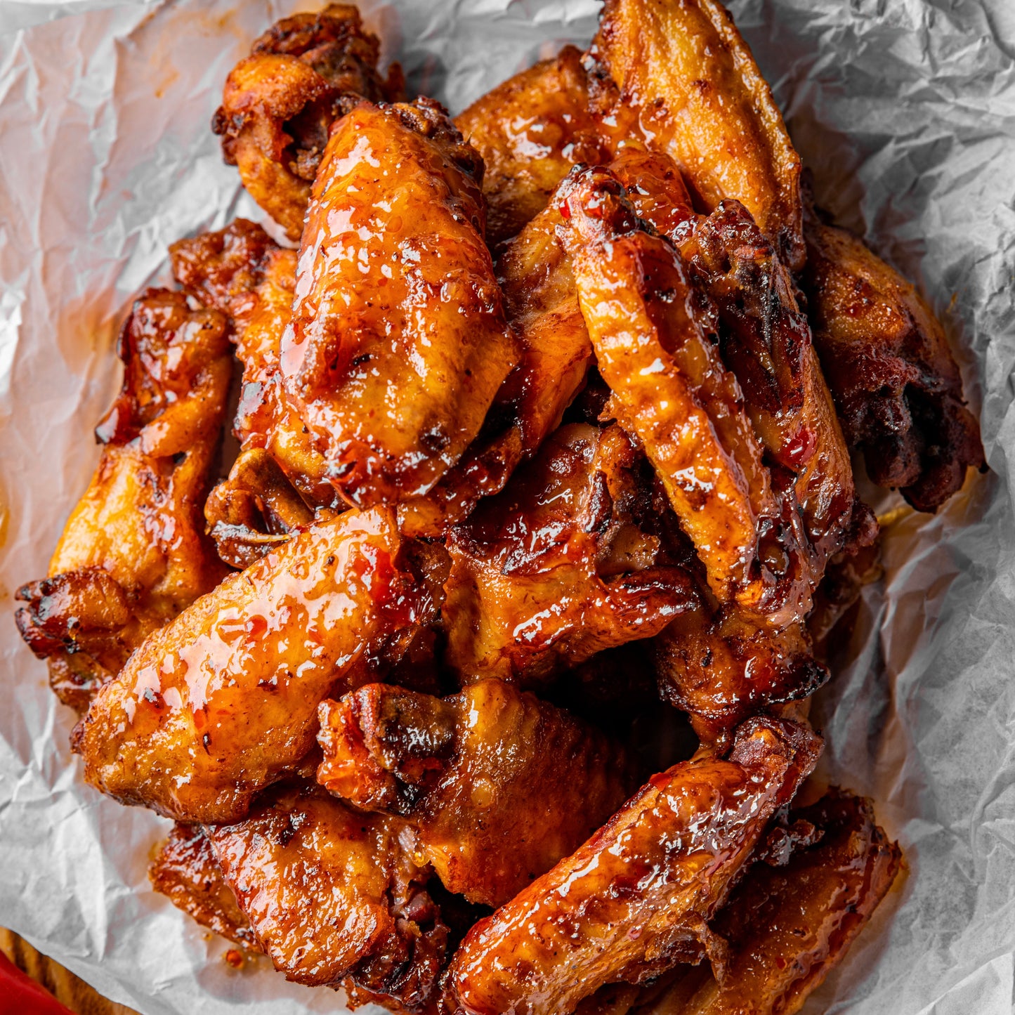 Baked chicken wings on crumpled parchment paper