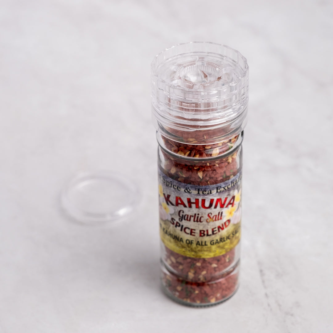 Kahuna Garlic Salt Spice Blend in grinder next to lid