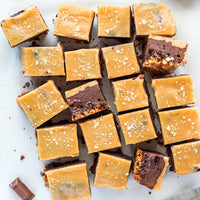 Caramel and chocolate bars sprinkled in sugar and sea salt flakes