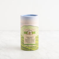 Herbal tea canister with green label on a white background