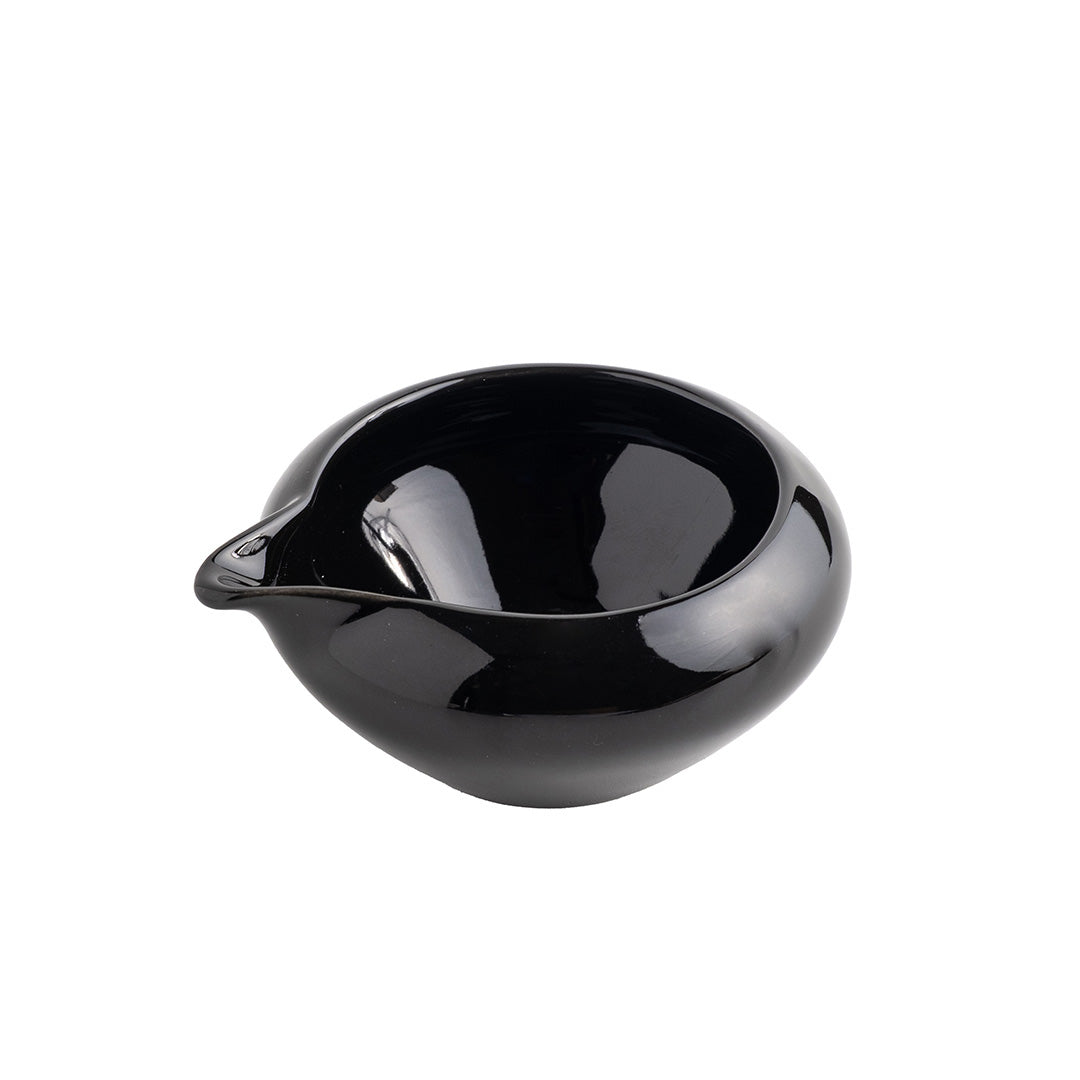 Black ceramic bowl on a white background