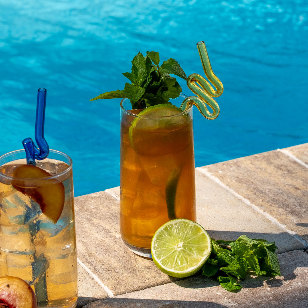 Mint Mojito Black Tea in glass with lime and mint garnish and served poolside