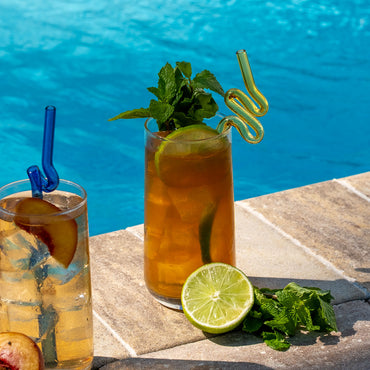 Mint Mojito Black Tea in glass with lime and mint garnish and served poolside
