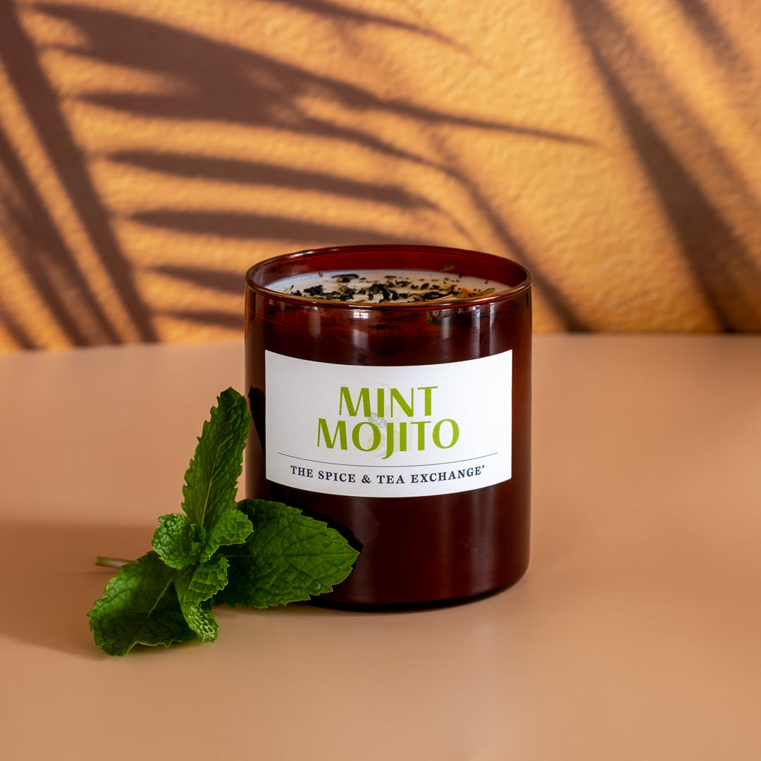 Mint Mojito Candle next to sprig of mint