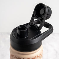 Close-up of a reusable bottle with a black flip-top lid and carrying loop, shown open against a light gray background.