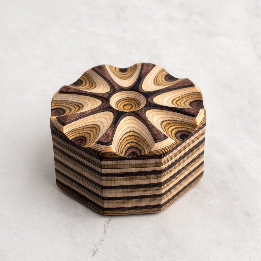 Natural Salt Cellar with closed lid on white granite