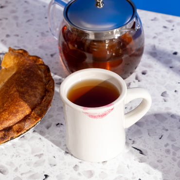Old Fashioned Oolong Tea in mug next to pie