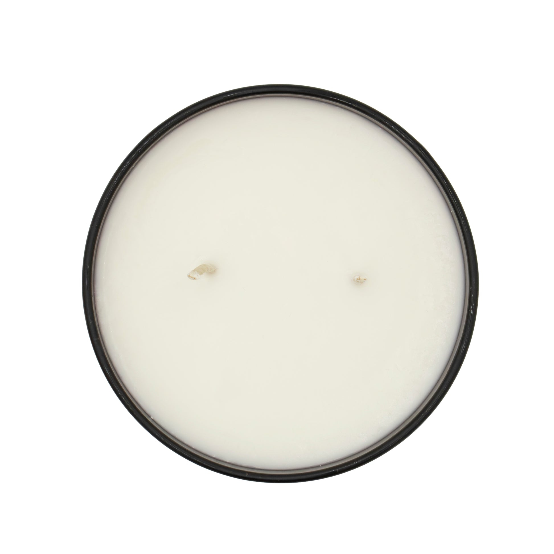 Round candle with a black lid on a white background