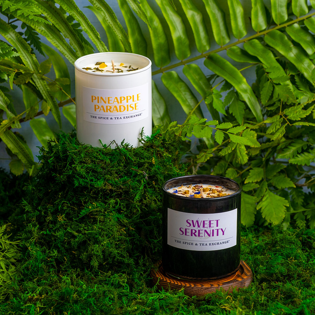 Pineapple Paradise Candle and Sweet Serenity Candle on green background