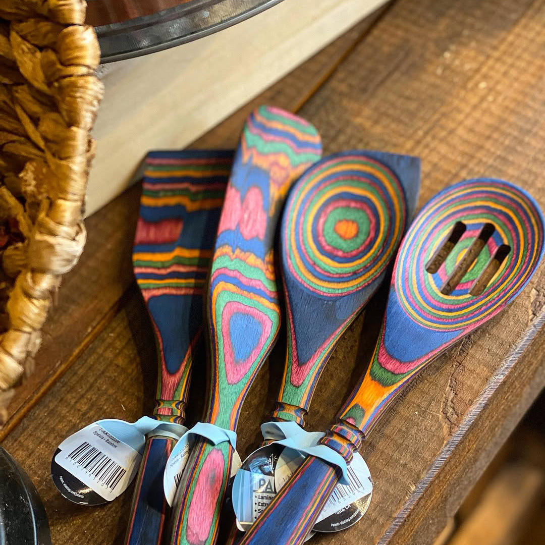 Rainbow Pakkawood corner spoon, slotted spoon, spatula, and spurtle.