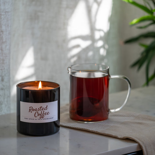 Roasted Coffee Candle on counter top next to brewed tea