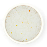 Saffron Fleur De Sel Sea Salt in a white bowl