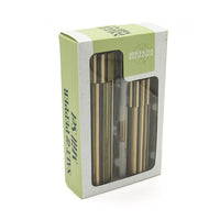 A boxed set of two striped mills with matching lids, presented in a white retail package with a clear window and a pale green label. The package shows the visible brand name 'Spice & Tea Exchange'. Side view.