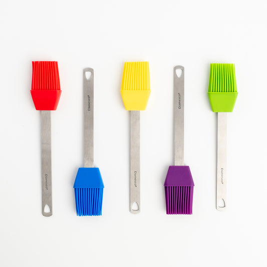 Five Mini Basting Brushes with stainless steel handles are lined up on a white background. The silicone heads—red, yellow, blue, purple, and green—make these brushes perfect grilling gifts.