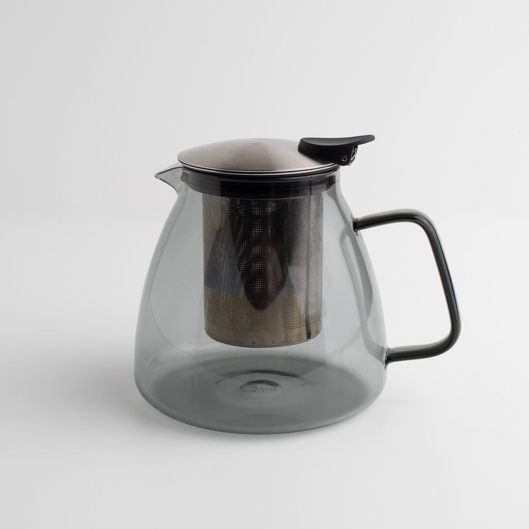 Stormy Glass Teapot with metal lid and handle on a white background