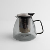 Stormy Glass Teapot with metal lid and handle on a white background