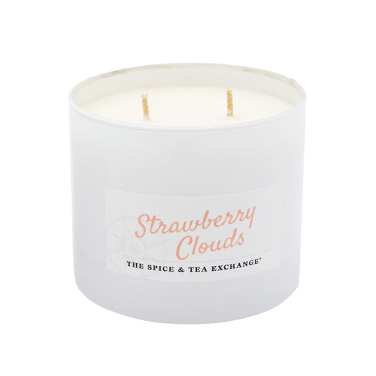 White candle with 'Strawberry Clouds' text on a white background