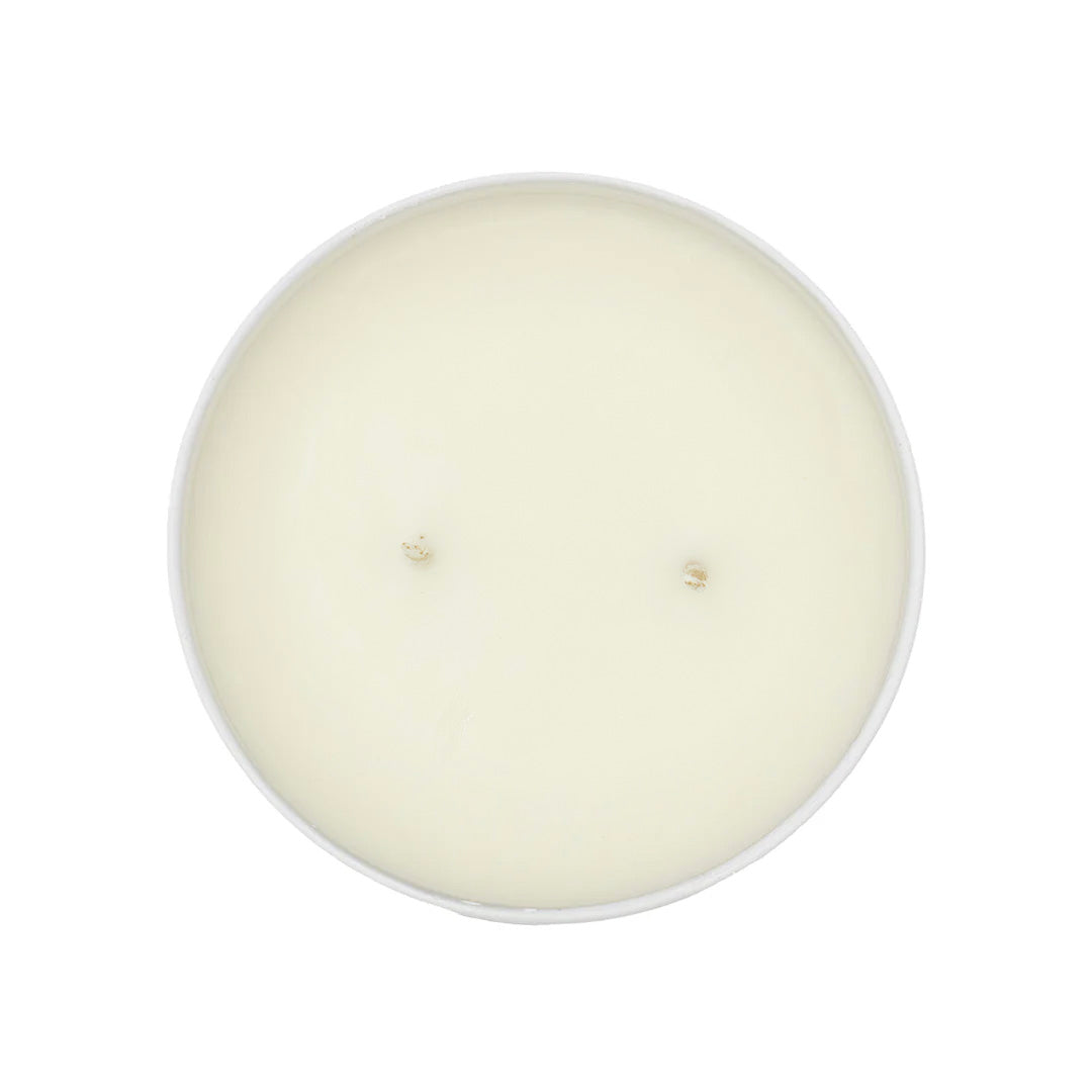 Round white candle on a white background