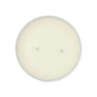 Round white candle on a white background